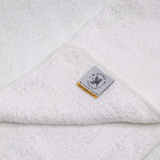 Luxurious and durable, the Oxford Gold Dobby Washcloth 13x 13 - 12 Per Pack, perfect for hotels and Airbnb hosts.