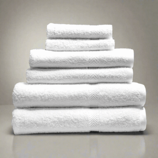 Stack of luxurious Oxford Gold Dobby Towels in brilliant white, crafted for softness and durability. Perfect for any bathroom.