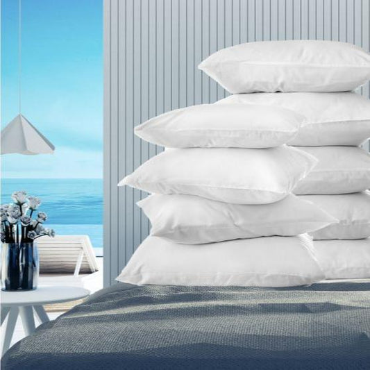 Luxurious Oxford Micro-Gel Pillows stacked on a bed, perfect for enhancing guest comfort in hospitality settings.
