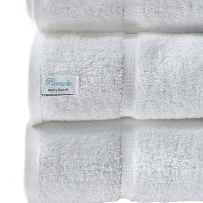 Luxurious Pinnacle Bath towels in brilliant white, crafted from 100% combed cotton for softness and durability.