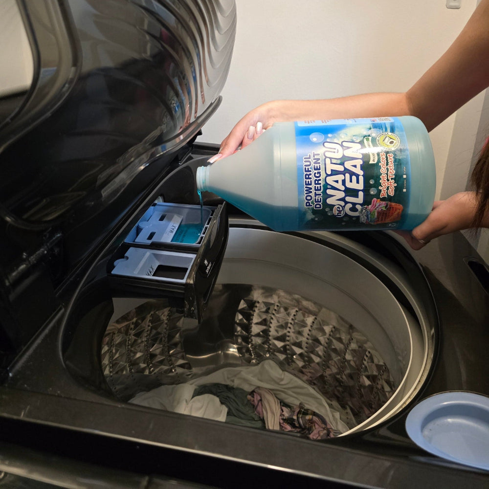 Pouring Natu Clean Laundry Detergent – 4 Gallons (Biodegradable) into a washing machine for a deep clean.