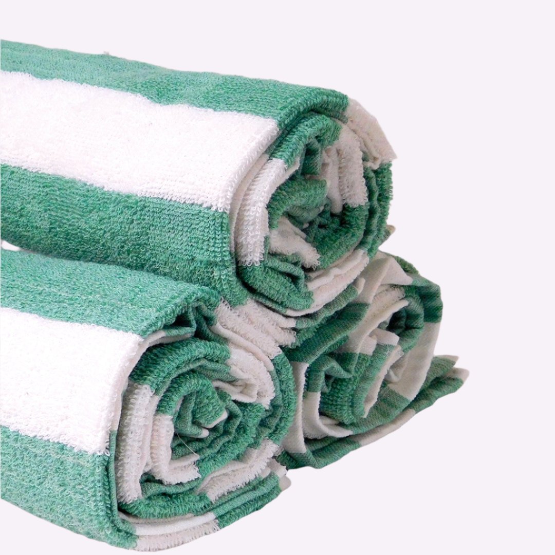 Soft, luxurious Oxford Basic Stripe Pool Towels 30" x 60" in green and white, perfect for enhancing poolside elegance.