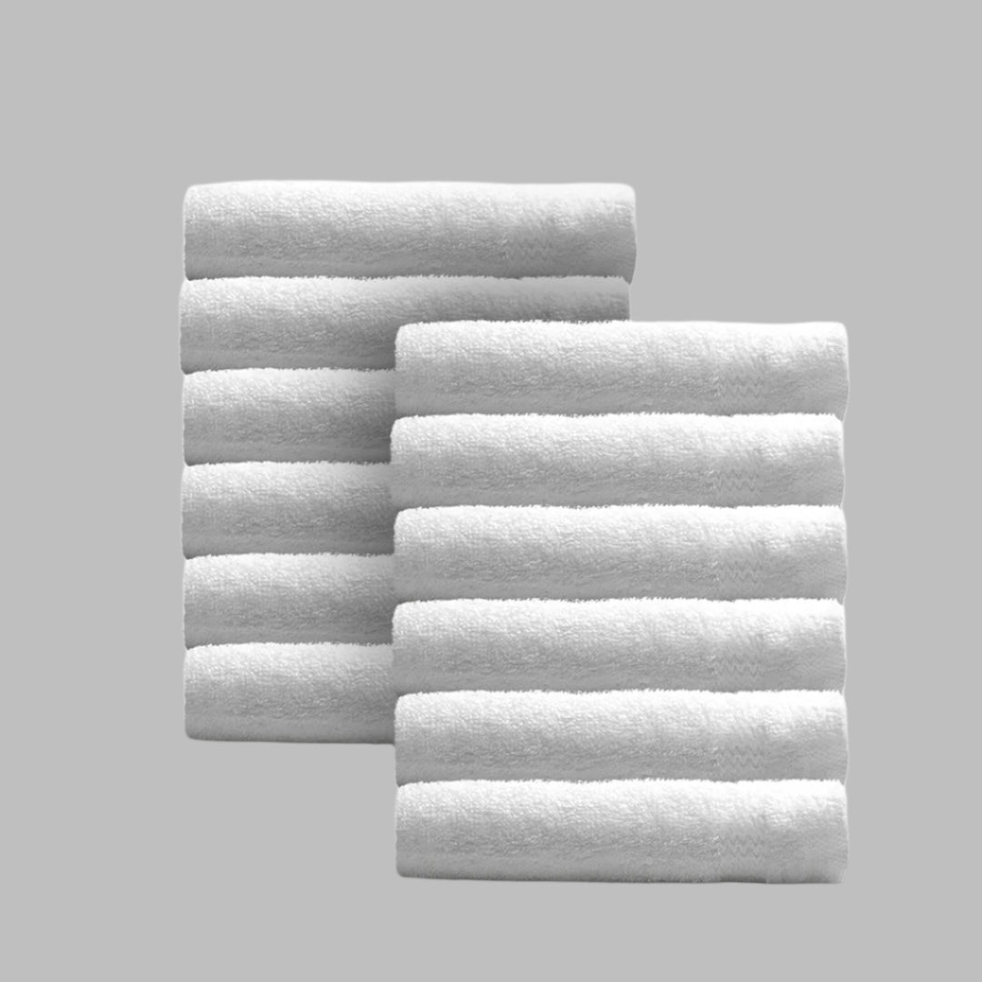 Pinnacle Bath hand towels in brilliant white feature plush 100% combed cotton for luxury and durability.