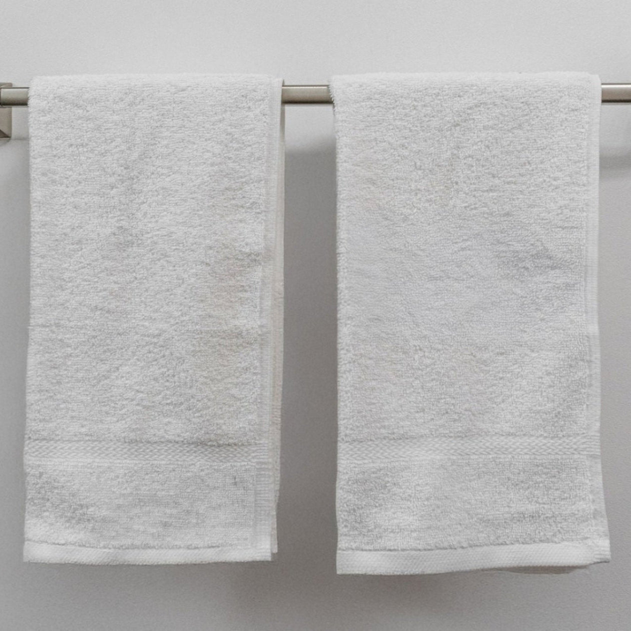 Luxurious Pinnacle Bath towels in brilliant white, made from 100% combed cotton for softness and durability.