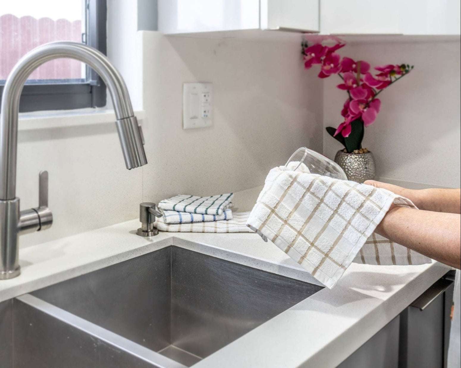 Stylish Premium Kitchen Towels – 12-Pack in use, perfect for cleaning and drying with elegant designs.