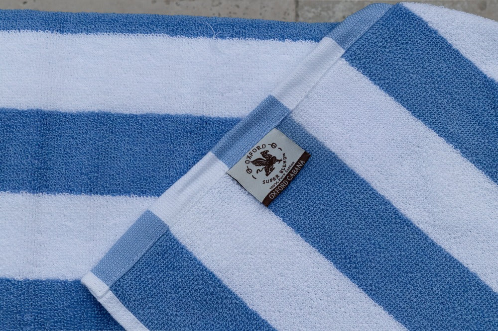 Upgrade your poolside with Oxford Premium Cabana Stripe Towels 30"x70", featuring soft, absorbent cotton in stylish blue stripes.