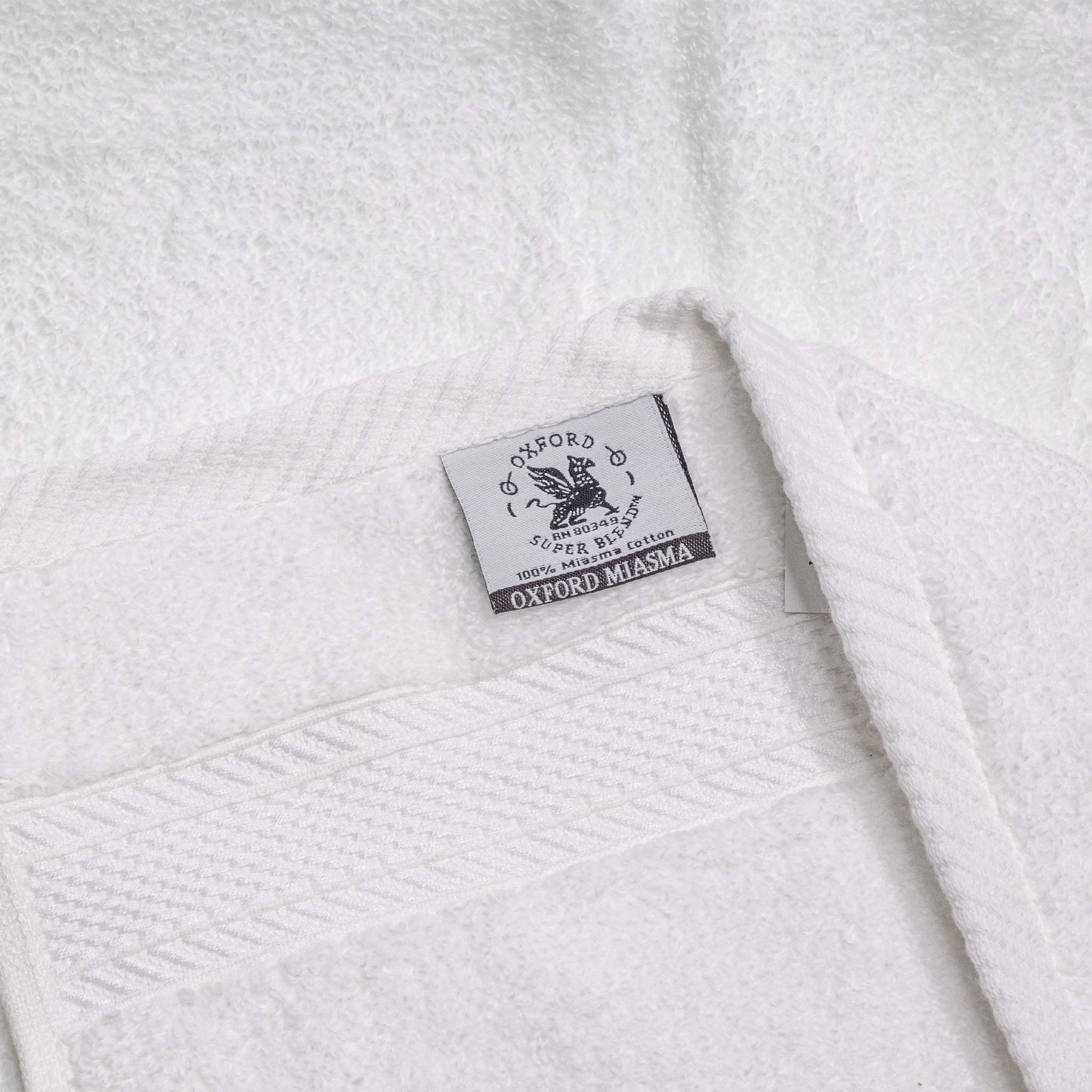 Oxford Miasma Bath towels showcase luxurious 100% cotton with a soft feel and elegant dobby border, ideal for hotels.