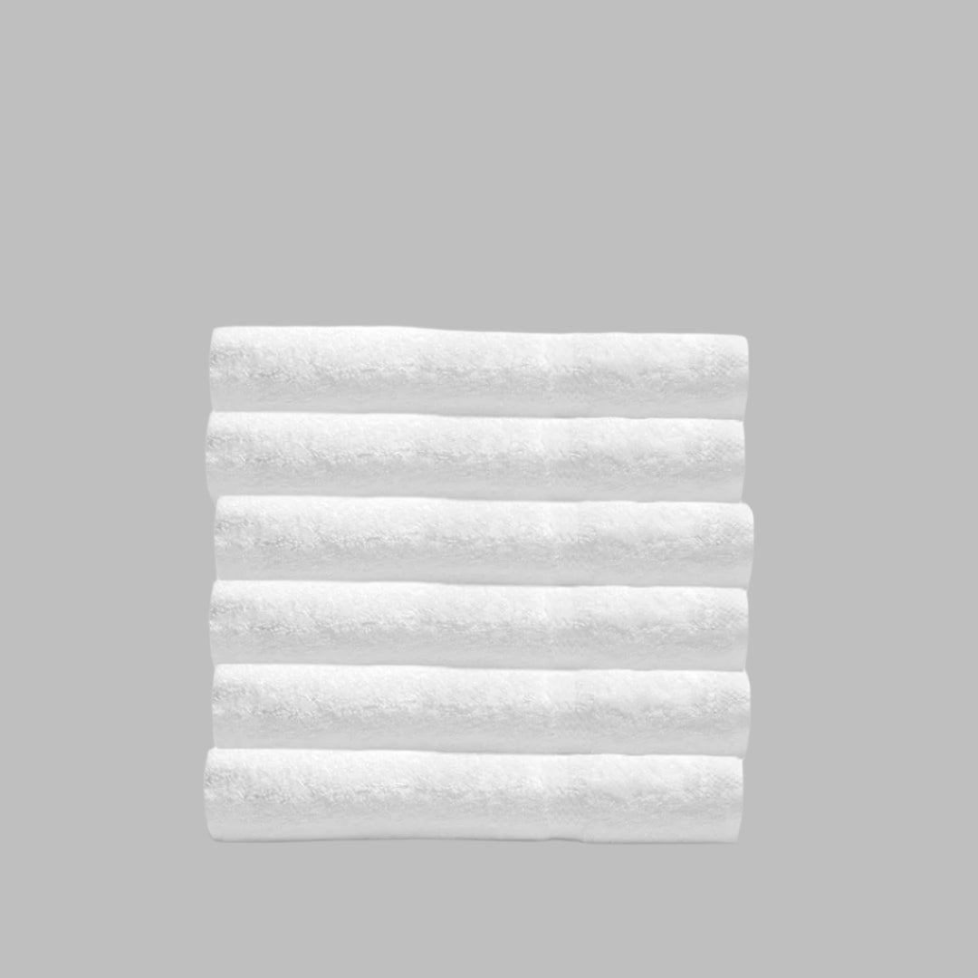 Pinnacle Bath towels in brilliant white offer luxury and durability, perfect for any bathroom décor.